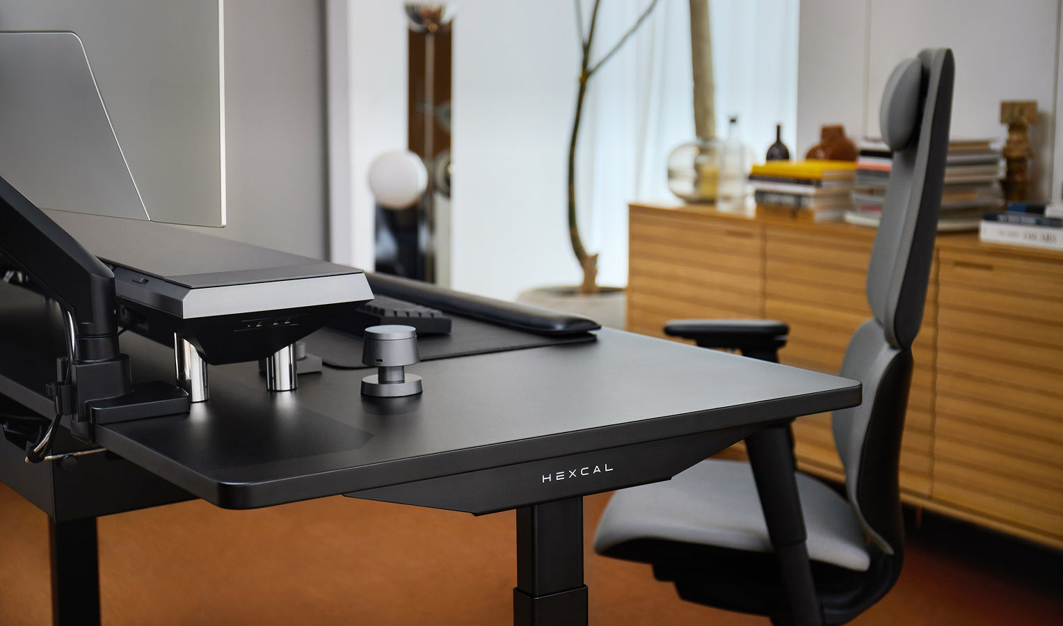 The Hexcal standing desk offers ergonomic comfort and a minimalist aesthetic for a focused, productive space.