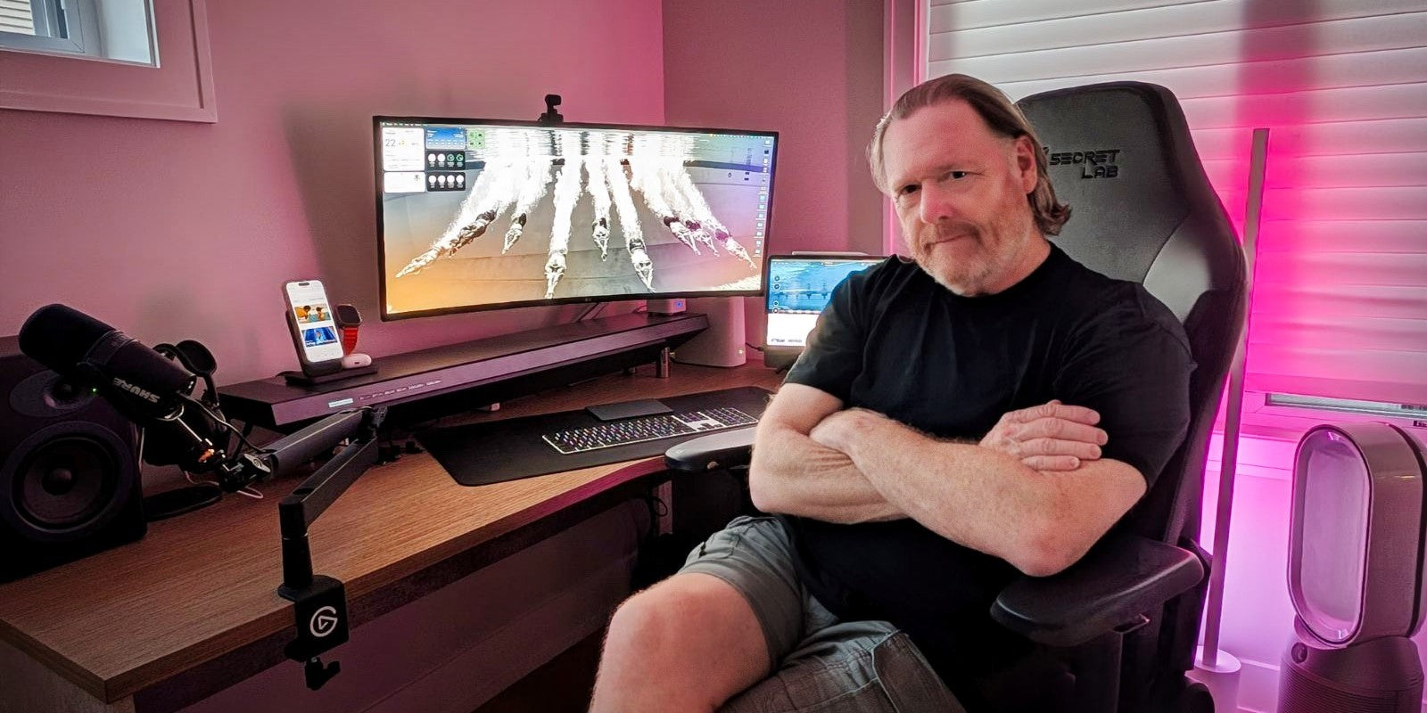Glenn Mills sitting in front of his home office, featuring Hexcal products.