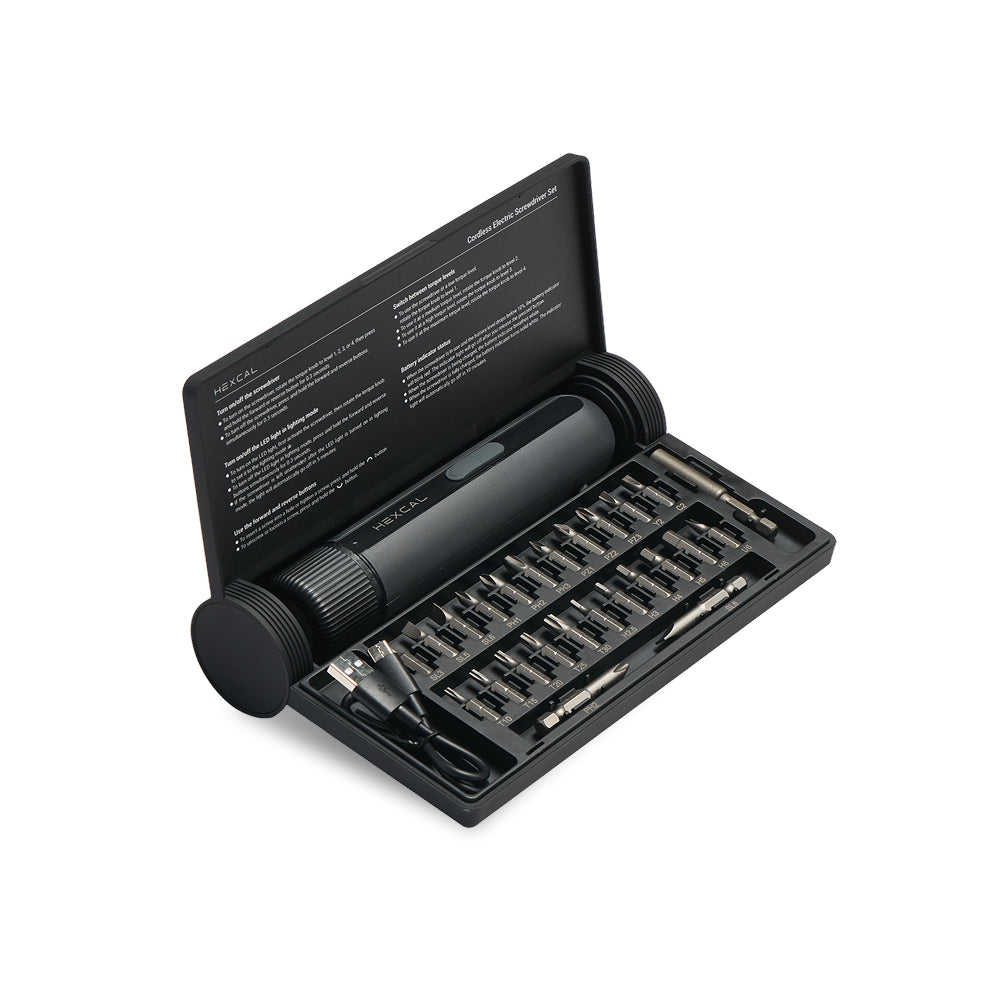 Black screwdriver set with bits in an open case on a white background