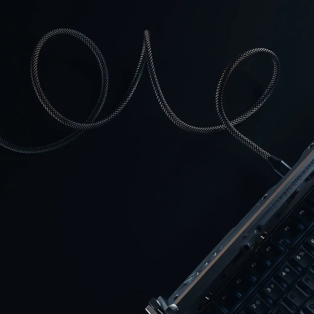 Hexcal Magnetic Cable designed with premium materials is charging a device keyboard.