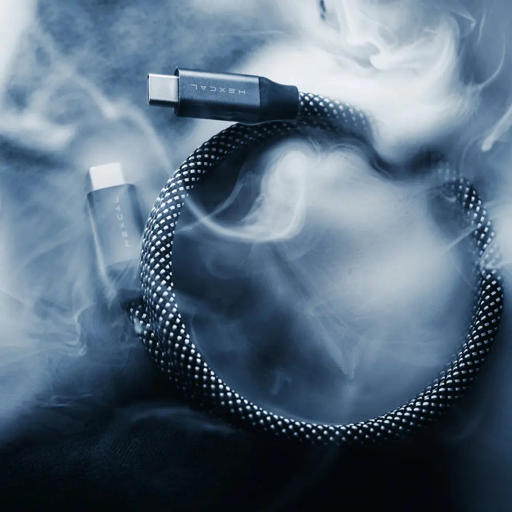 Hexcal Magnetic Cable surrounded by soft smoke, emphasizing its sleek design.