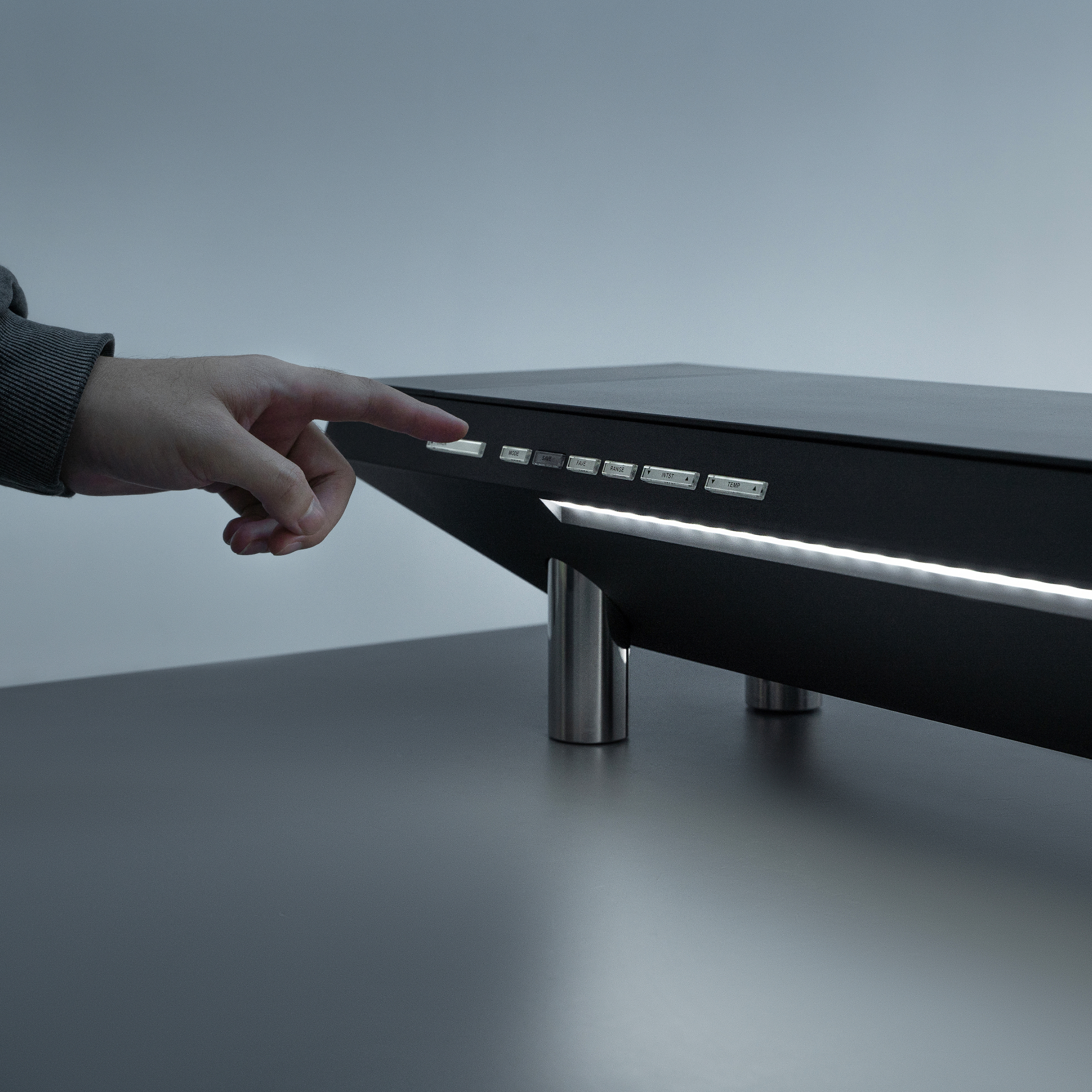 A user is turning on the Hexcal Studio's immersive task light system.