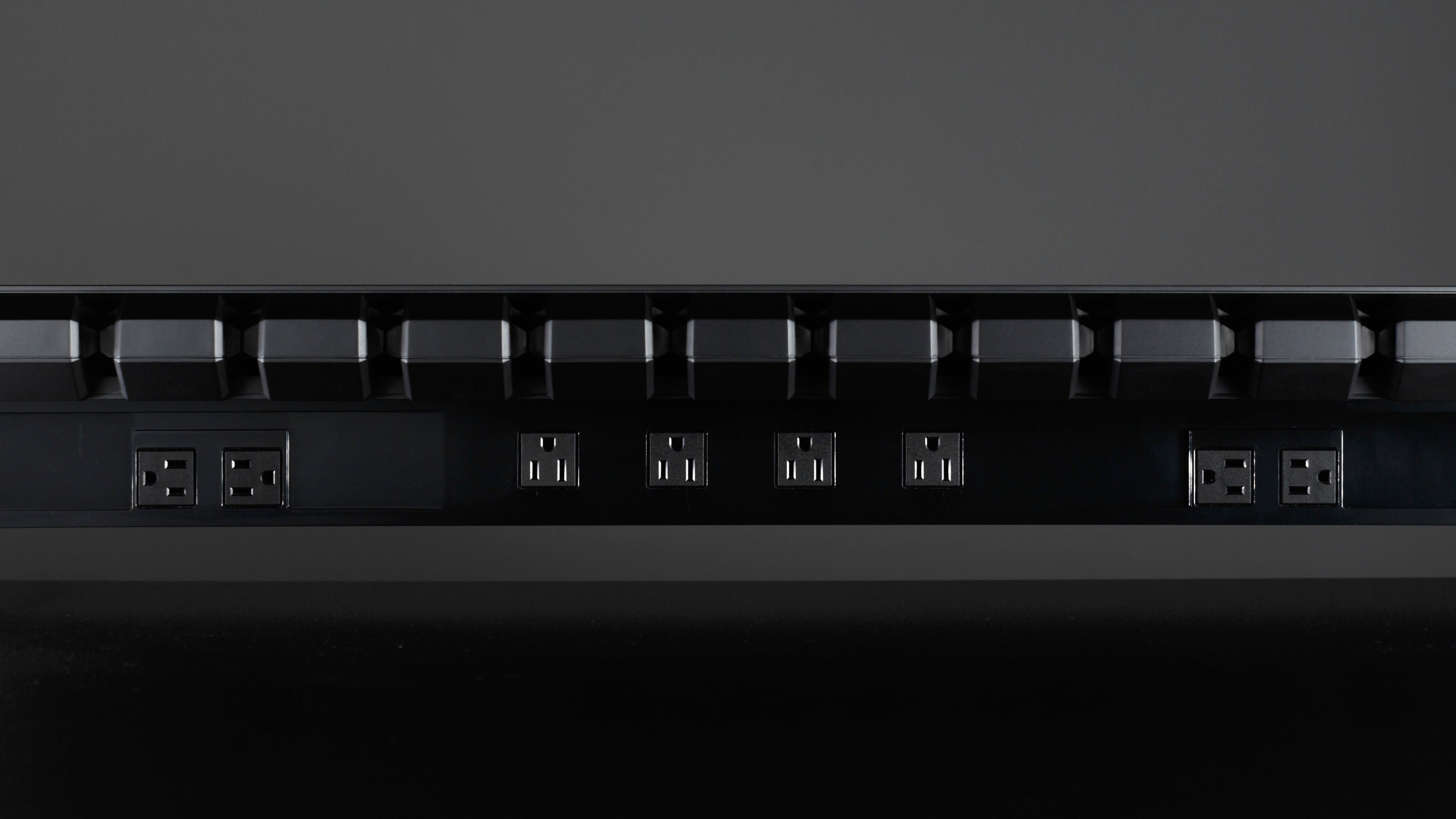 This monitor stand provides 8 outlets PDU for desk power supply.