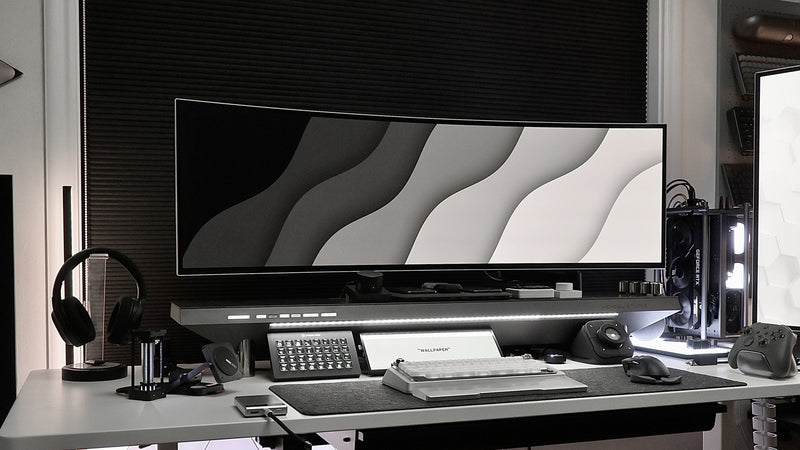 Ultrawide screen and desktop equipment on a standing workstation