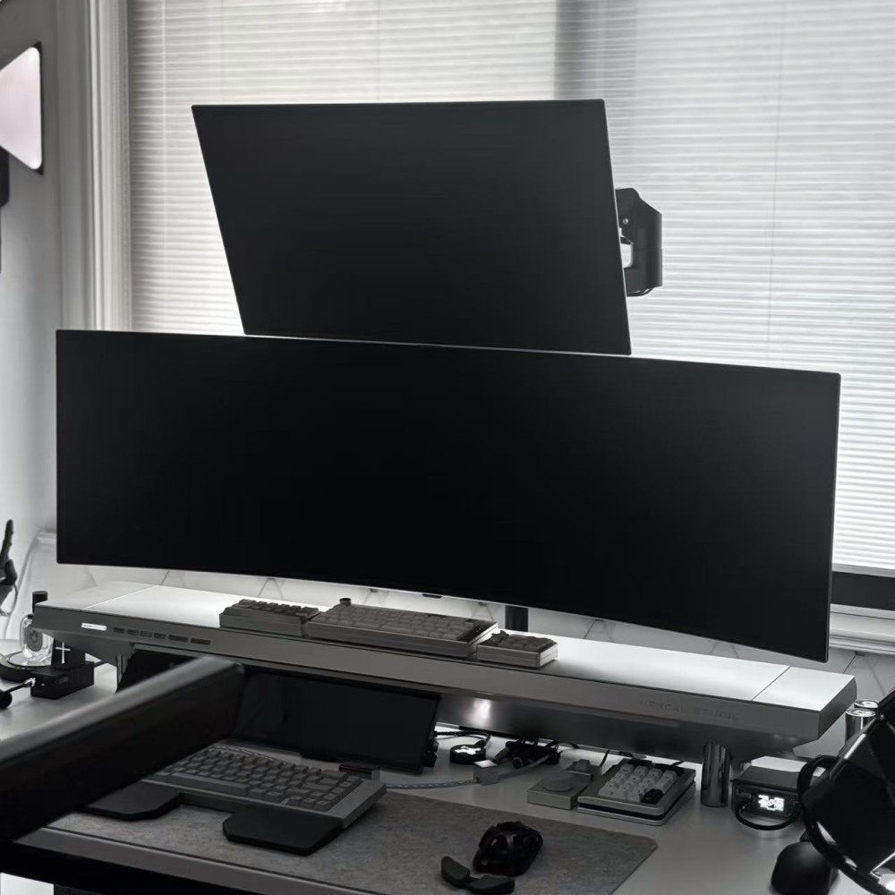Hexcal Monitor Mount System showing full adjustability range.