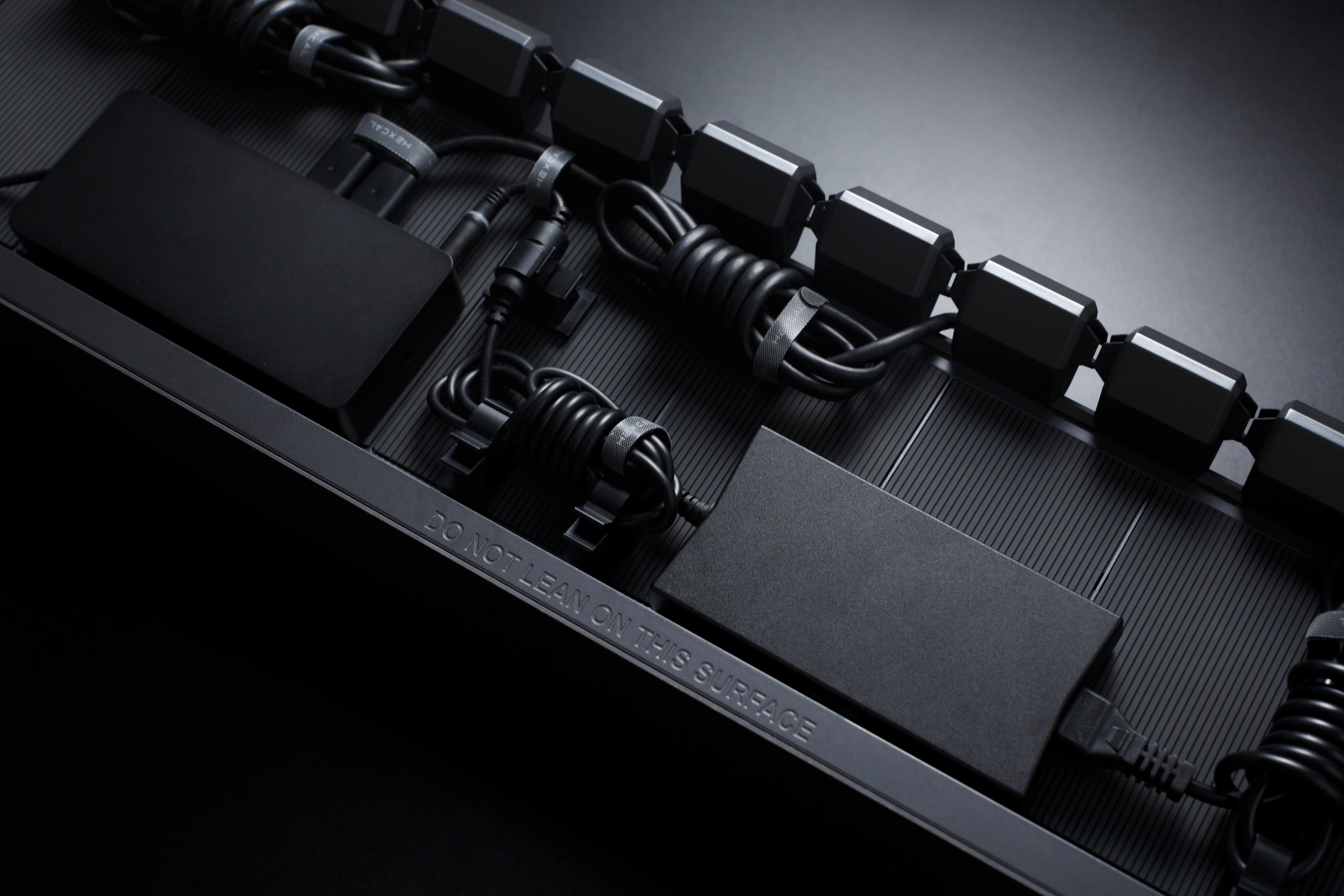 Hexcal Studio's innovative cable management solution to keep your desk organized and clean.