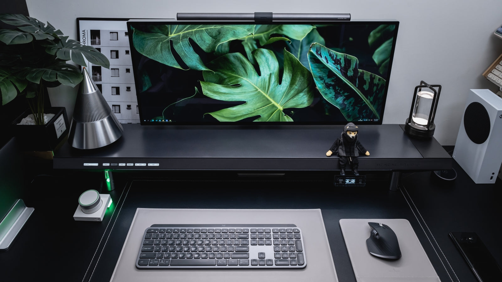 A clean desk setup idea includes premium standing desk, monitor stand and other desk products.