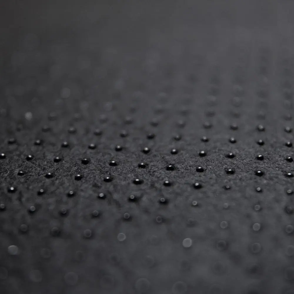 Hexcal Desk Mat anti-slip base material providing grip on smooth surfaces.