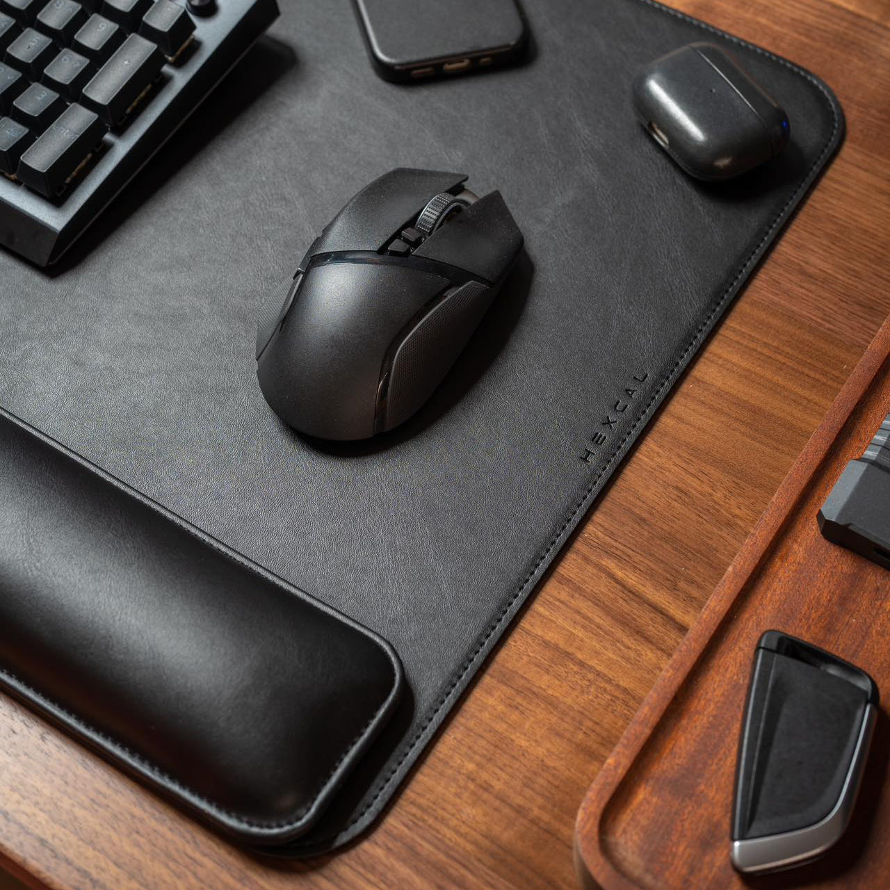 Hexcal Desk Mat magnetic wrist rest attached securely to the mat on a desk.