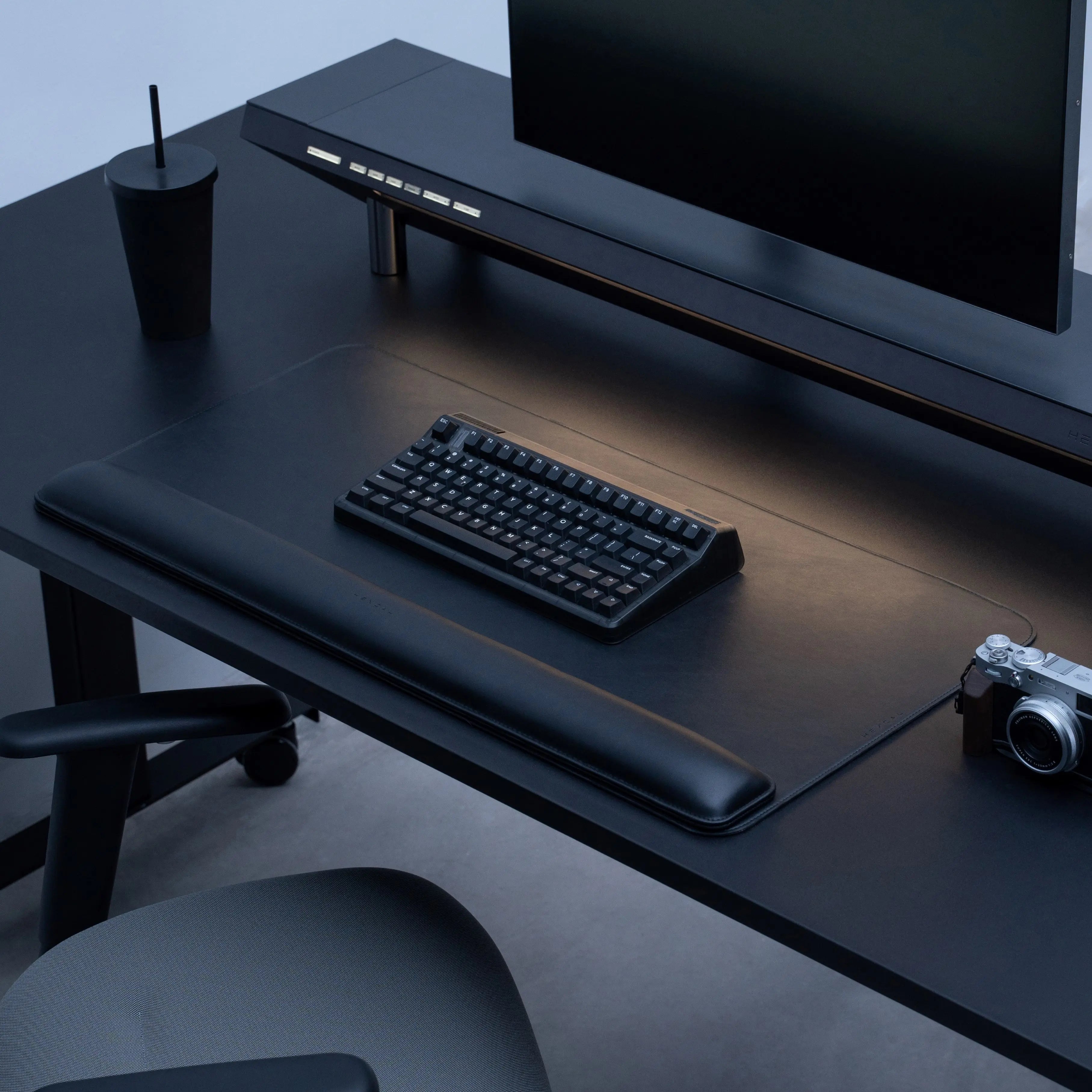 Hexcal Desk Mat with Studio and other products in a full desk setup.
