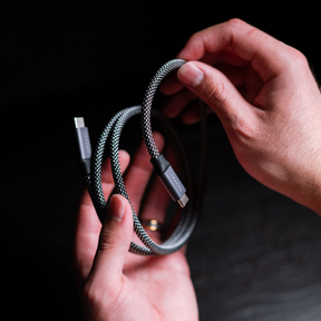 A customer holding the Hexcal Magnetic Cable in his hand, showcasing its magnetic functionality.